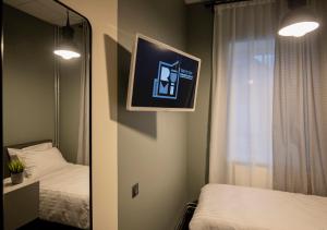 Postel nebo postele na pokoji v ubytování RUMI Hotel with Self Check-In