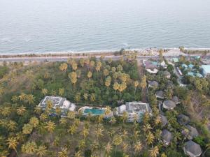 an aerial view of a resort next to the ocean at Tanaosri Resort Pranburi in Pran Buri