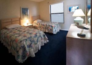 Postelja oz. postelje v sobi nastanitve Cape Winds Resort