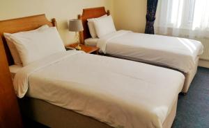 Letto o letti in una camera di Heritage Home Dhulikhel