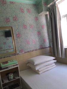 Postel nebo postele na pokoji v ubytování Aries Guest House