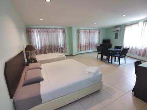 Ένα ή περισσότερα κρεβάτια σε δωμάτιο στο GS BERA HOTEL SDN BHD