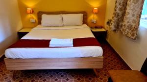Cama o camas de una habitación en Ruby Apartments 4