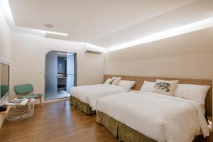 Voodi või voodid majutusasutuse Ya Nold Hot Spring Hotel toas