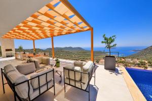 a patio with a view of the ocean at Villa Pastoral in Kas
