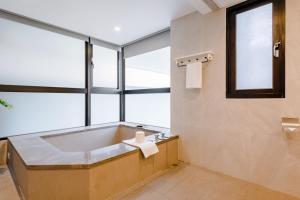 Voodi või voodid majutusasutuse ISPAVITA B&B Resort toas