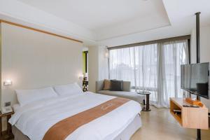 Voodi või voodid majutusasutuse ISPAVITA B&B Resort toas
