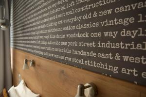 a writing on the wall of a hotel room at Roombach Hotel Budapest Center in Budapest