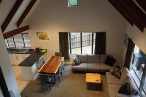 a living room with a couch and a table at Lazy Daze in Wanaka