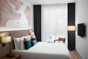 a hotel room with a bed and a window at Akka Suites Taksim-Special Class in Istanbul