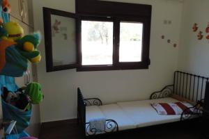 Ein Bett oder Betten in einem Zimmer der Unterkunft Villa Maria Ποσείδι Χαλκιδικής Σπίτι με θέα