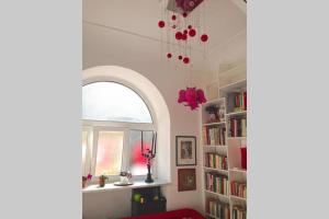 a room with a window and a book shelf at Boutique by the Sea in Positano