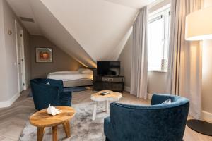 Postel nebo postele na pokoji v ubytování Hampton home B&B suites