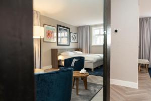 Postel nebo postele na pokoji v ubytování Hampton home B&B suites