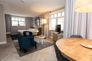 Postel nebo postele na pokoji v ubytování Hampton home B&B suites