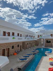 a view of the courtyard of a hotel with a swimming pool at Carmine Hotel Dahab in Dahab