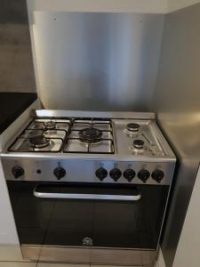 a stove top oven sitting inside of a kitchen at Gîte Santenay les Bains in Saint-Sernin-du-Plain