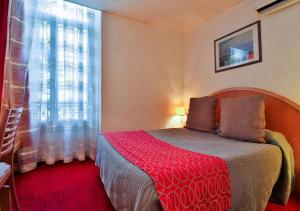 Un ou plusieurs lits dans un hébergement de l'établissement Hôtel restaurant Oasis