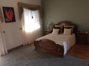 Uma cama ou camas num quarto em SOLAR DA SERRA-GuestHouse