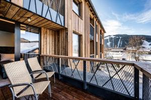 
Ein Balkon oder eine Terrasse in der Unterkunft Almmonte Präclarum Suites Design Hotel
