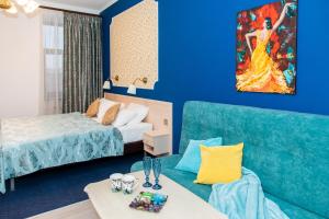Кровать или кровати в номере Гостевые комнаты и апартаменты Грифон