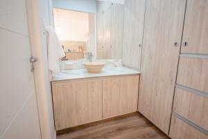 a bathroom with a sink and a mirror at Augusta in Salta +68 photos