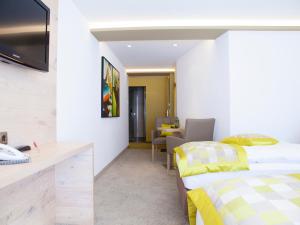 Postel nebo postele na pokoji v ubytování Hotel Neder
