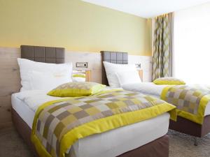 Postel nebo postele na pokoji v ubytování Hotel Neder