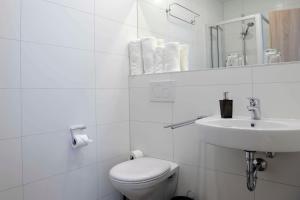 Ванная комната в Das Falk Apartmenthaus
