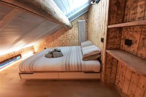 Postel nebo postele na pokoji v ubytování Dream House Quadrifoglio. Sulle piste di Folgarida,madonna di campiglio.