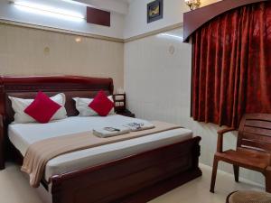 Postel nebo postele na pokoji v ubytování Grand View Residency Chennai + 37 fotografií