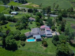an aerial view of a house with a swimming pool at Dunroamin Bed and Breakfast in Mooirivier