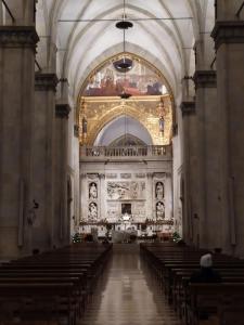 an empty church with pews and a large ceiling at Pensione Delfino Azzurro in Loreto