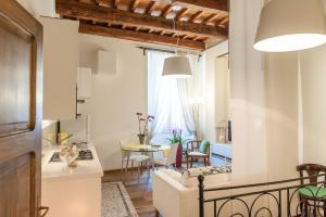 a living room with a couch and a table at Borgo dei Salinari Apartments in Cervia