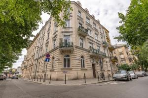 a large building on the side of a street at Jacuzzi Apartment Zen in Kraków