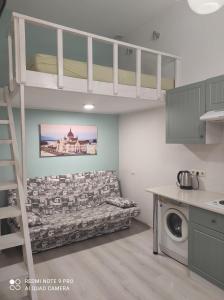 a living room with a couch and a bunk bed at Apartment Smart світло не вимикають 24-7 in Poltava