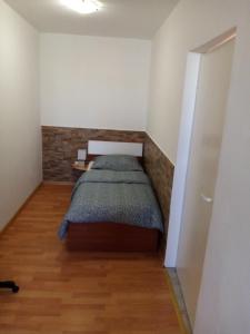 a small bedroom with a bed in a room at Apartment Buic in Pula
