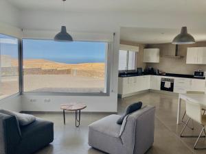 A kitchen or kitchenette at Casa Achaman - Contemporary style villa with outstanding views