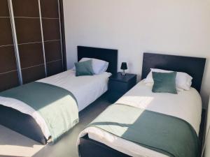 A bed or beds in a room at Casa Achaman - Contemporary style villa with outstanding views