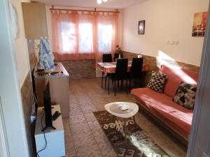 a living room with a couch and a table at Apartment Buic in Pula