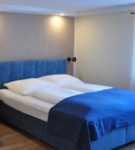 Postel nebo postele na pokoji v ubytování CHILL&SLEEP Bad Ischl