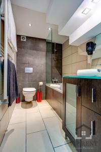 a bathroom with a toilet and a shower and a sink at Casa Pairal Candia in Encamp