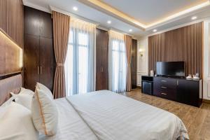 Postel nebo postele na pokoji v ubytování Hotel Trí Lê