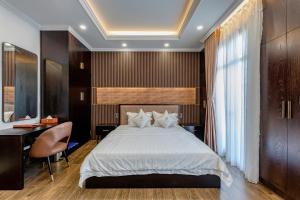 Postel nebo postele na pokoji v ubytování Hotel Trí Lê