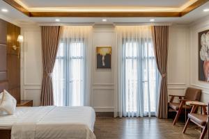Postel nebo postele na pokoji v ubytování Hotel Trí Lê