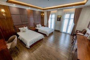 Postel nebo postele na pokoji v ubytování Hotel Trí Lê