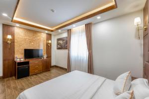 TV a/nebo společenská místnost v ubytování Hotel Trí Lê