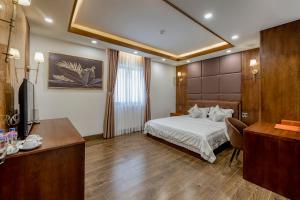 Postel nebo postele na pokoji v ubytování Hotel Trí Lê