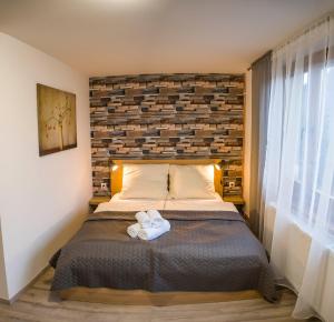 Postel nebo postele na pokoji v ubytování Apartmány Habovka