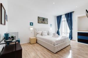 Postel nebo postele na pokoji v ubytování Ripetta Central Suites